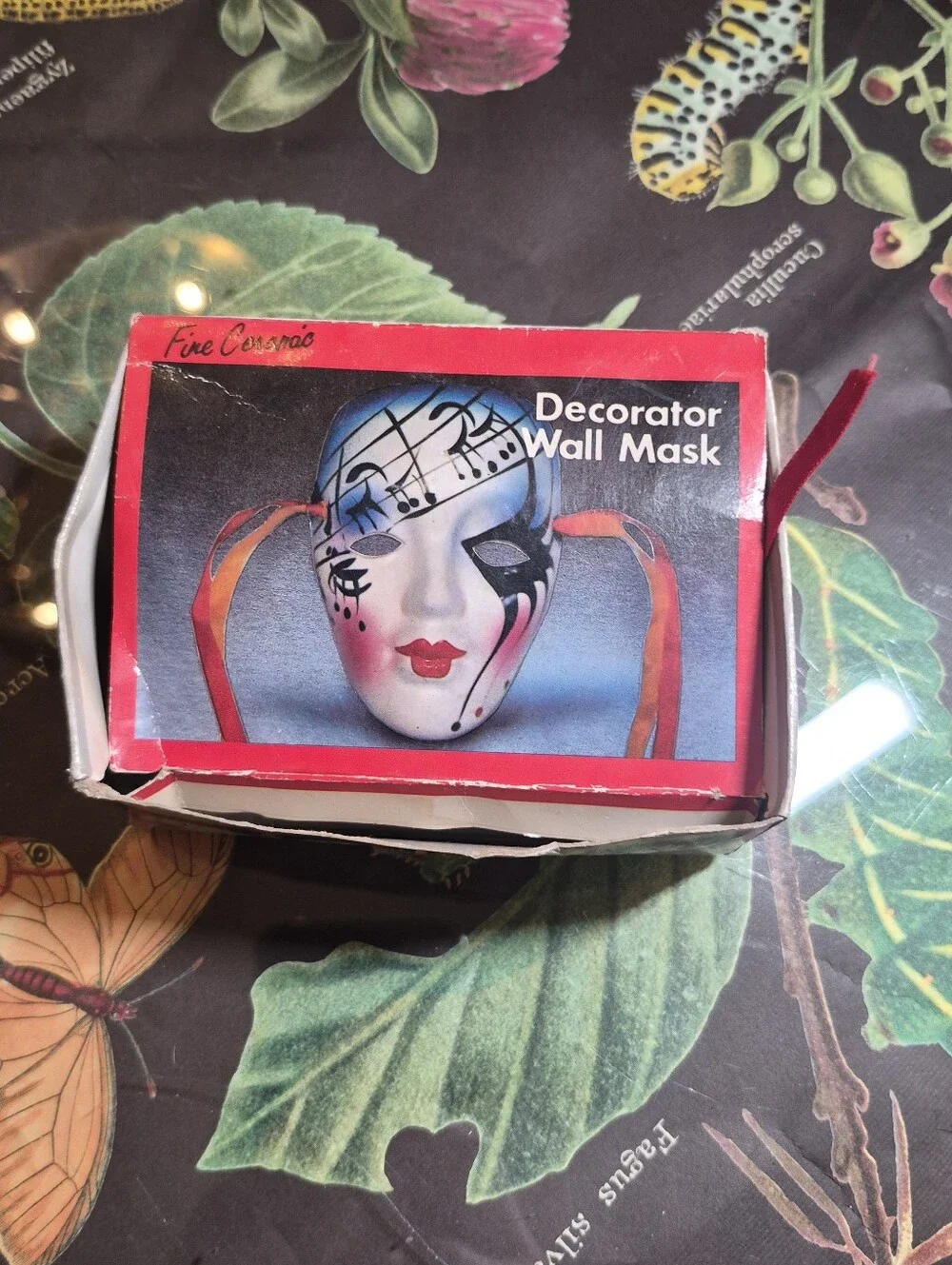 Black and Gold Decorative Venetian-Style Mask with Red & Black Ribbons